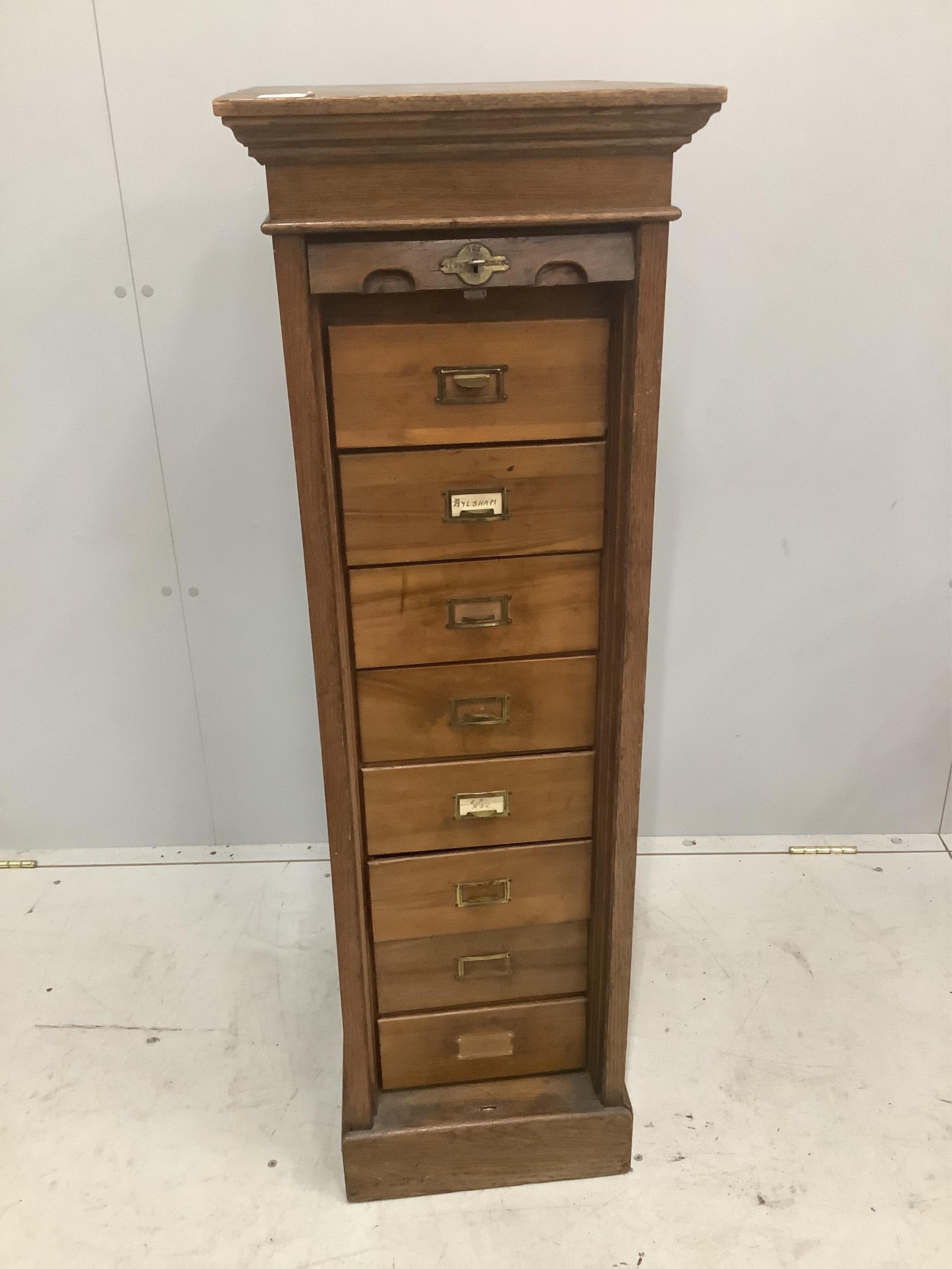 An early 20th century oak Lebus tambour filing cabinet, width 37cm, depth 49cm, height 116cm. Condition - poor to fair